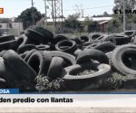 Invaden predio con llantas